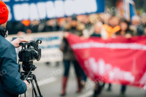 Preview: Making news, media cameraman at a public protest