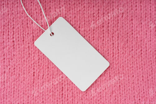 Preview: Template Of Blank Clothing Label, Price Tag On Pink Knitted Sweater Background