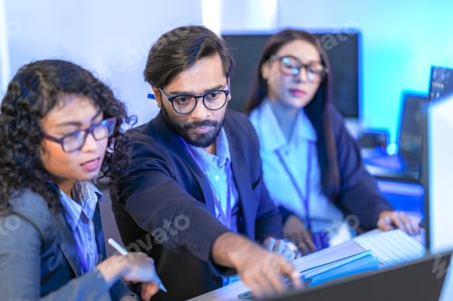 Preview: A diverse team of three developers brainstorming a solution.