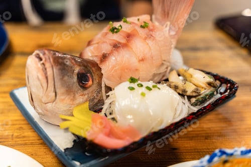 Preview: Sashimi of sea bass fillet, fresh squid and shell on ceramic plate