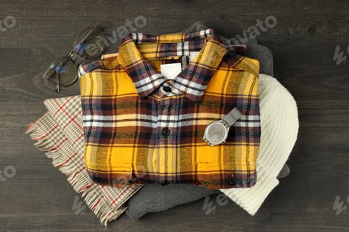 Preview: Plaid Shirt with Accessories on Dark Wood Surface