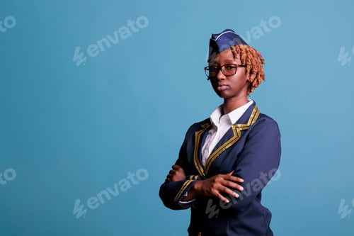 Preview: Serious female flight crew member wearing uniform