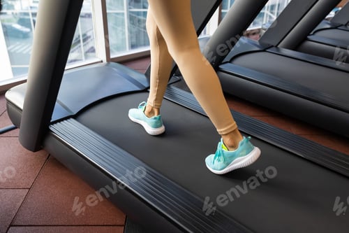 Preview: Fitness woman walking and running in the treadmill