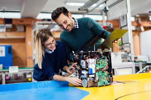 Preview: Young students of robotics working on project