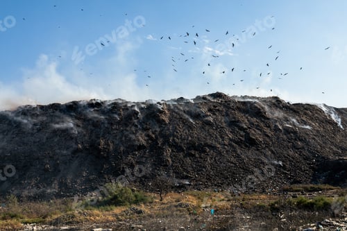 Preview: Landfill with burning trash piles