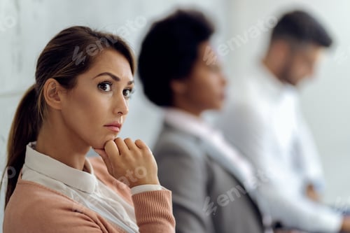 Preview: Young pensive businesswoman waiting for job interview.
