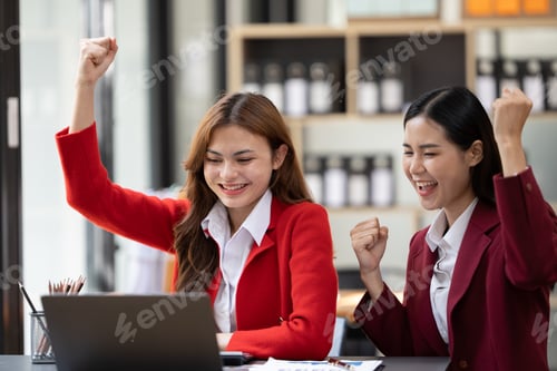 Preview: Excited concept, Happy young woman high fiving with colleague in office.