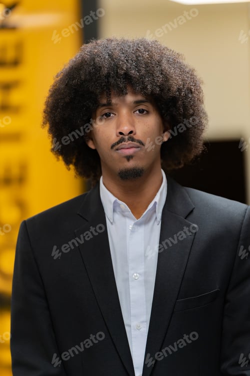 Preview: Serious businessman in office setting.