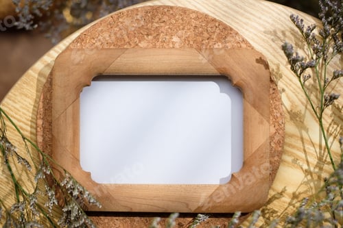 Preview: mockup wooden photo frame on round table with evening sunlight