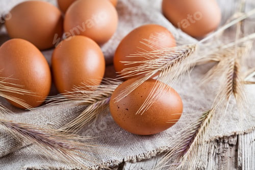 Preview: fresh brown eggs and wheat ears