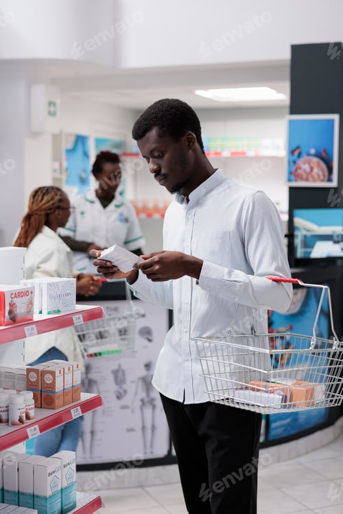 Preview: African american customer shopping in drugstore, buying supplements