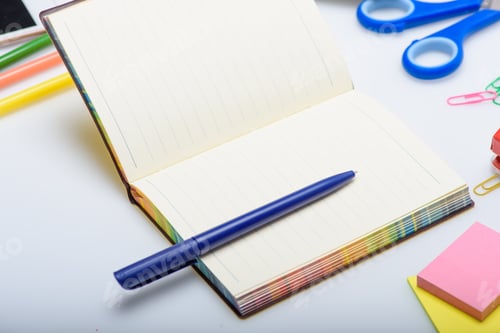 Preview: empty copybook and different school supplies isolated on white