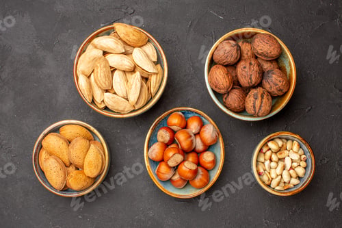 Preview: top view nut composition different fresh nuts on dark background plant tree nuts walnut