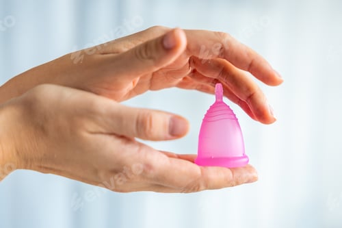 Preview: Reusable Menstrual Cup in Female Hands
