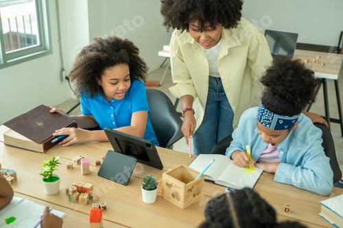 Preview: Black girl in classroom with diverse group of children learning new stuff.