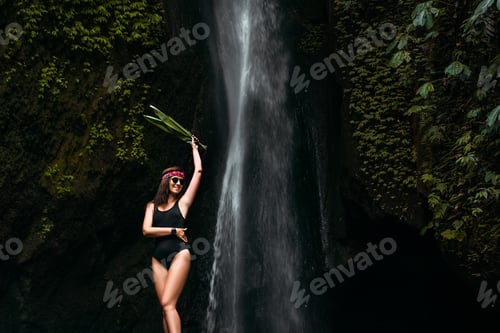 Preview: Portrait of a beautiful smiling girl at the Waterfall