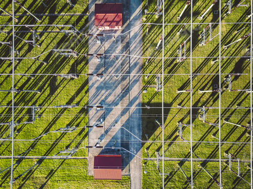 Preview: Directly above electrical substation with electrical wires spread around the power station