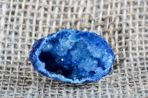Preview: Azurite stone on the rough burlap fabric surface
