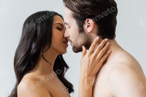 Preview: nude brunette woman and man kissing with closed eyes isolated on grey