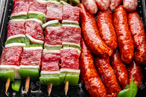 Preview: sausage meat assorted juicy pork, beef fresh delicious gourmet food background on the table rustick