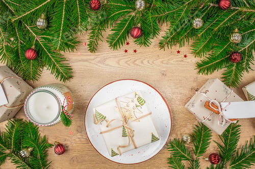 Preview: Beautiful table setting with Christmas decor and Christmas gift box. top view. copy space