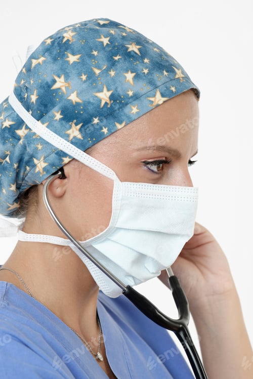 Preview: Surgeon wearing surgical cap, mask and stethoscope looking away