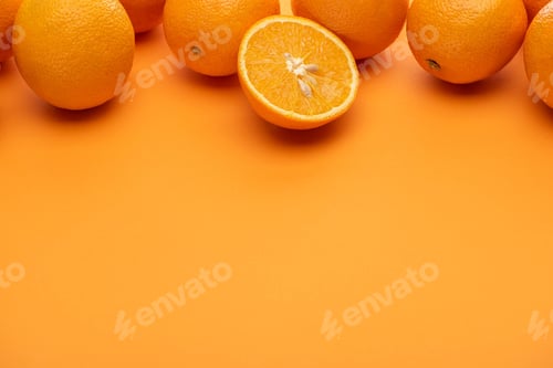 Preview: ripe juicy whole and cut oranges on colorful background