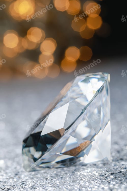 Preview: Large dazzling brilliant on shiny surface against blurred festive lights