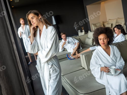 Preview: Happy young people enjoying wellness spa resort treatments
