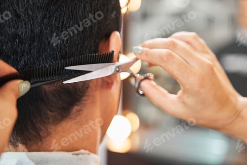 Preview: Person doing haircut to client with scissors