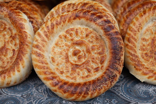 Preview: Typical traditional flatbread with crunchy crust with sesam just baked