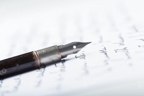 Preview: Fountain pen rests on handwritten notes during a writing session in a quiet space