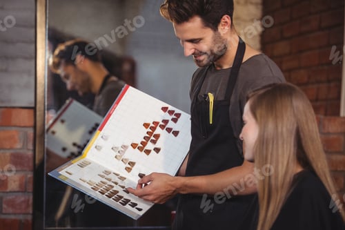 Preview: Woman selecting a hair color with stylist