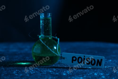 Preview: Flask with poison on textured table against dark background, closeup