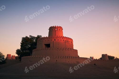 Preview: Outside view on towers of historical fort at sunrise. Al Ain, United Arab Emirates