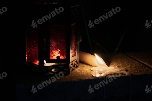 Preview: A lighted candle and a candlestick