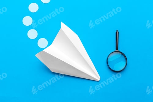 Preview: Flat lay of white paper plane and blank paper on pastel blue color background