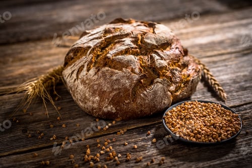 Preview: Freshly baked bread on rustic wooden background