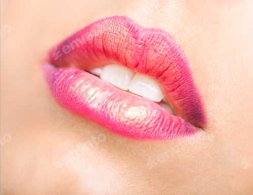 Preview: Close up portrait of a beautiful young model with bright make up
