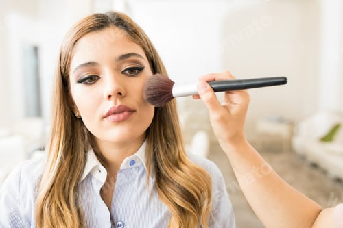 Preview: Woman getting some blush in a salon