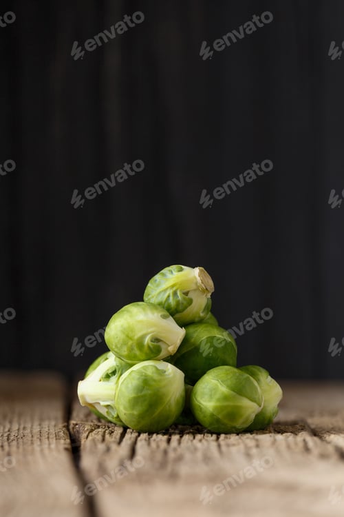 Preview: Fresh Brussels sprouts on wooden background