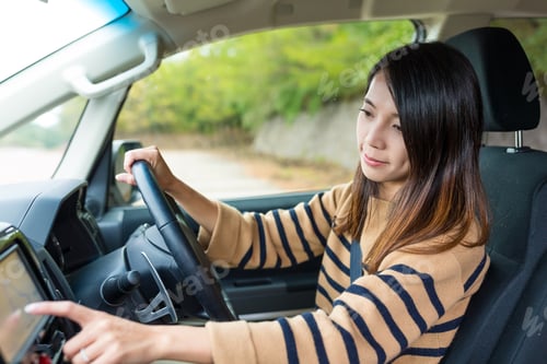 Preview: Woman checking the location on the screen