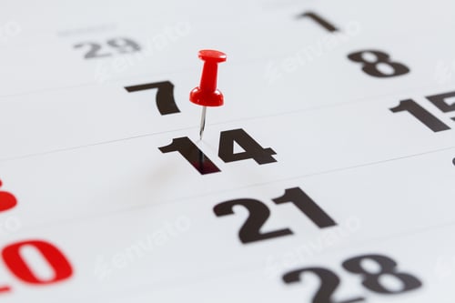 Preview: Pin pushed on a calendar concept for an important day.