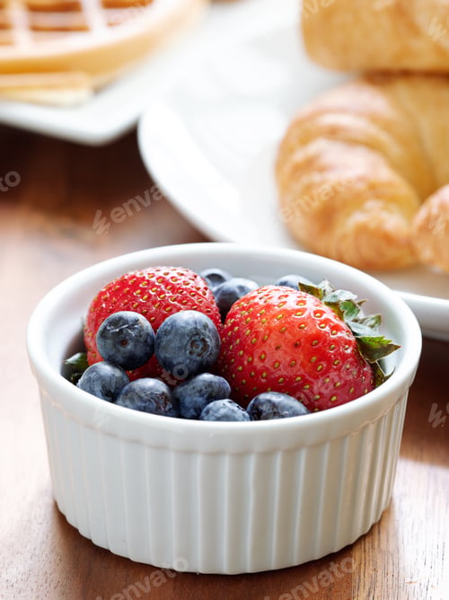 Preview: breakfast setting with blueberries and strawberries.