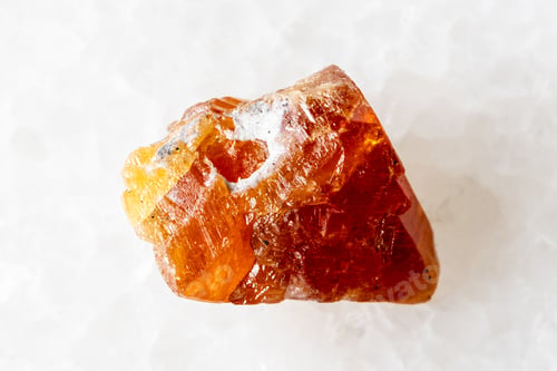 Preview: sample of raw scheelite mineral on white marble