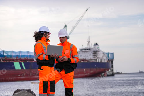 Preview: engineers communicate while inspecting dockside logistics