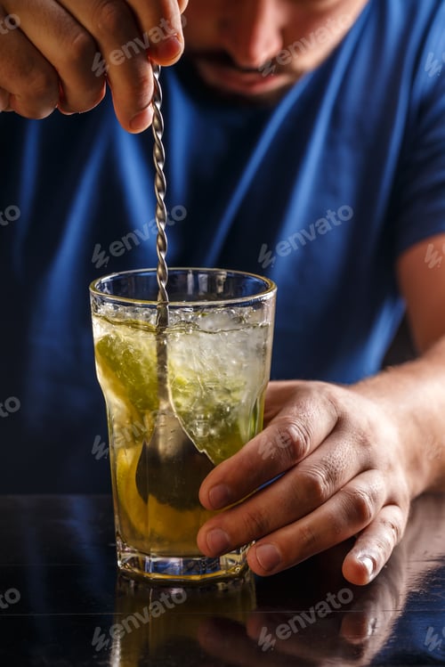 Preview: Bartender is stirring cocktails