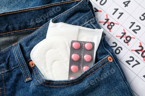 Preview: Menstruation period concept on jeans background, close up