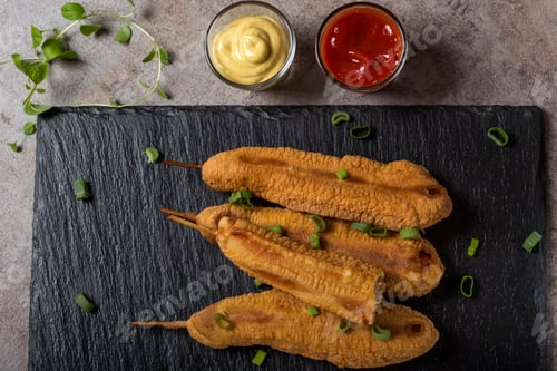 Preview: Four fresh corn dogs