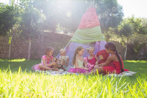 Preview: Five girls playing with teddy bears in front of teepee